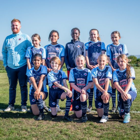LMYFC Girls U12s team with coach