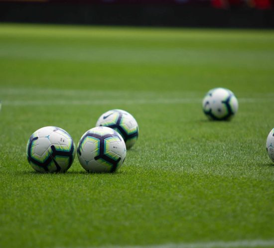 footballs on a pitch