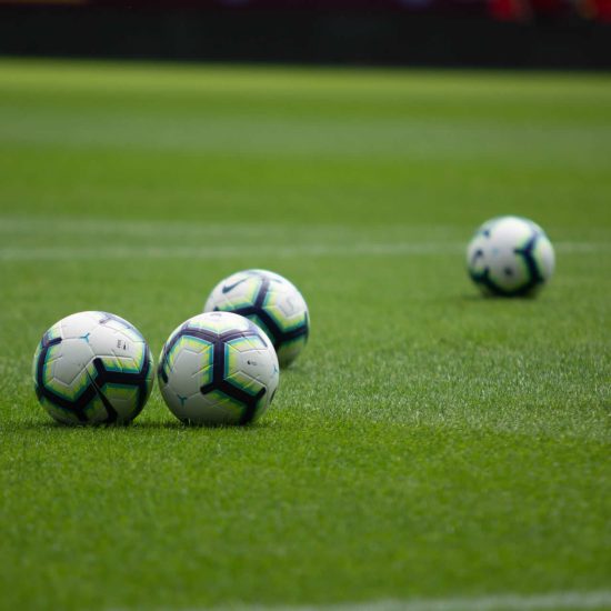 footballs on a pitch